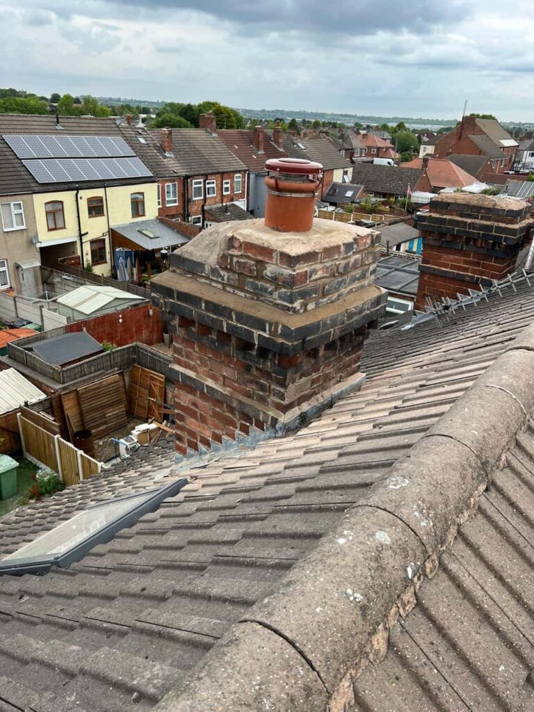 This is a photo taken from a roof which is being repaired by Oxted Roofing Repairs, it shows a street of houses, and their roofs