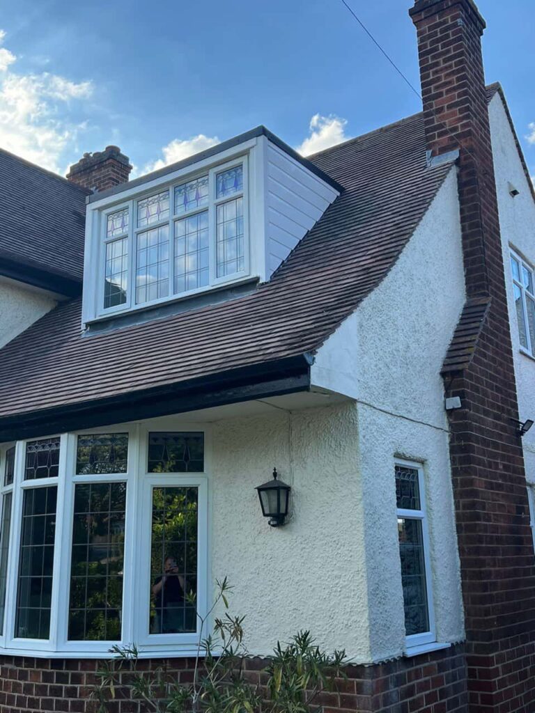 This is a photo of a dormer window which has just had some repairs carried out where the roof and the dormer meet. Works carried out by Oxted Roofing Repairs